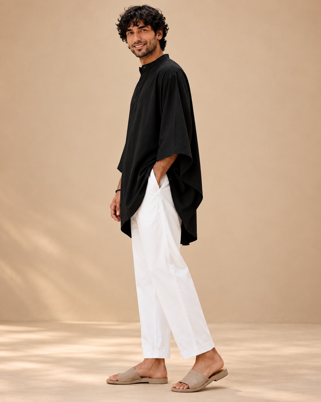 Side profile showing the kurta’s asymmetric hem